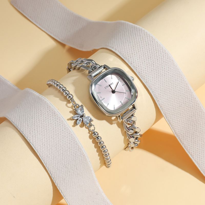 Dameur og smykkesæt med lilla Aurora-urskive og firkantet armbåndsur + armbåndssæt med sommerfuglesten til studerende_voghion.com