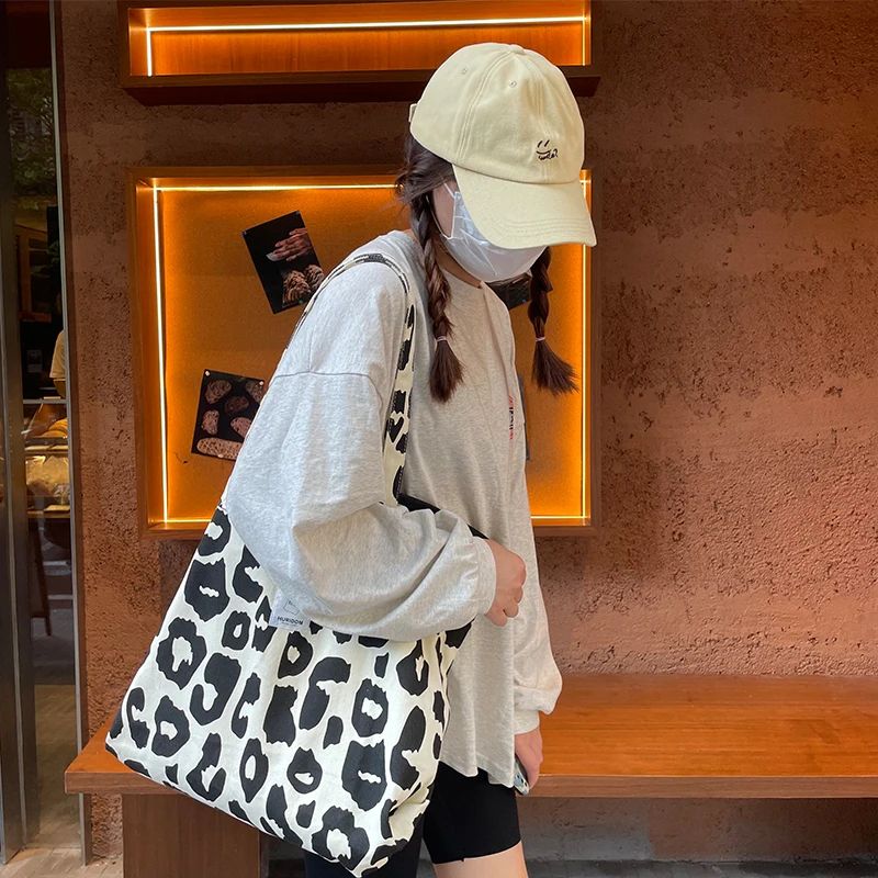 Bolso de lona de diseño moderno para mujer, de alta capacidad, con estampado de vaca y bandolera._voghion.com
