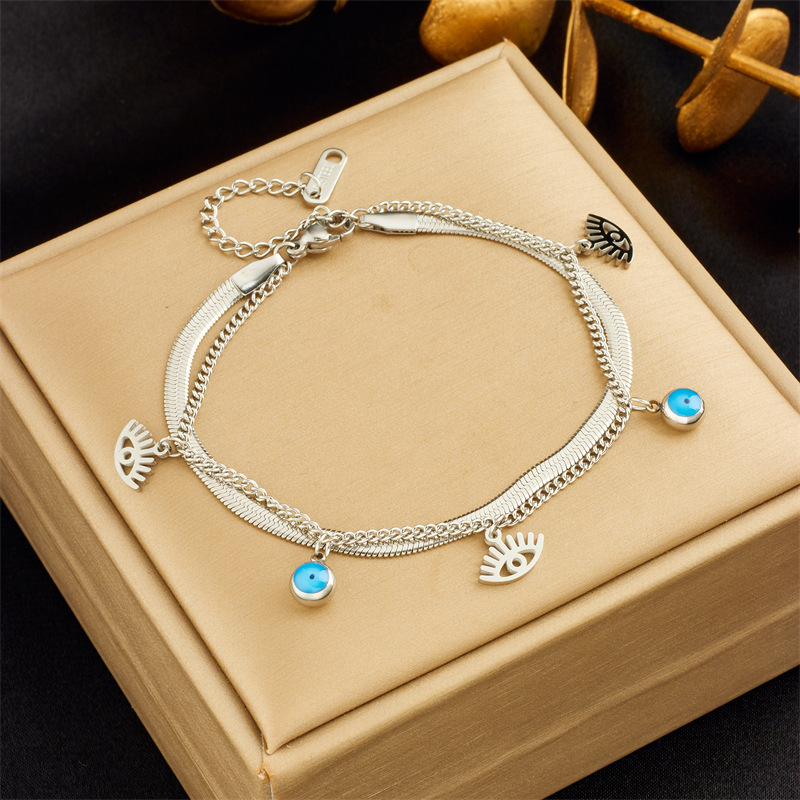 European and American fashion niche retro high-end double-layer stacking diamond round blue eye star lightning pendant bracelet_voghion.com