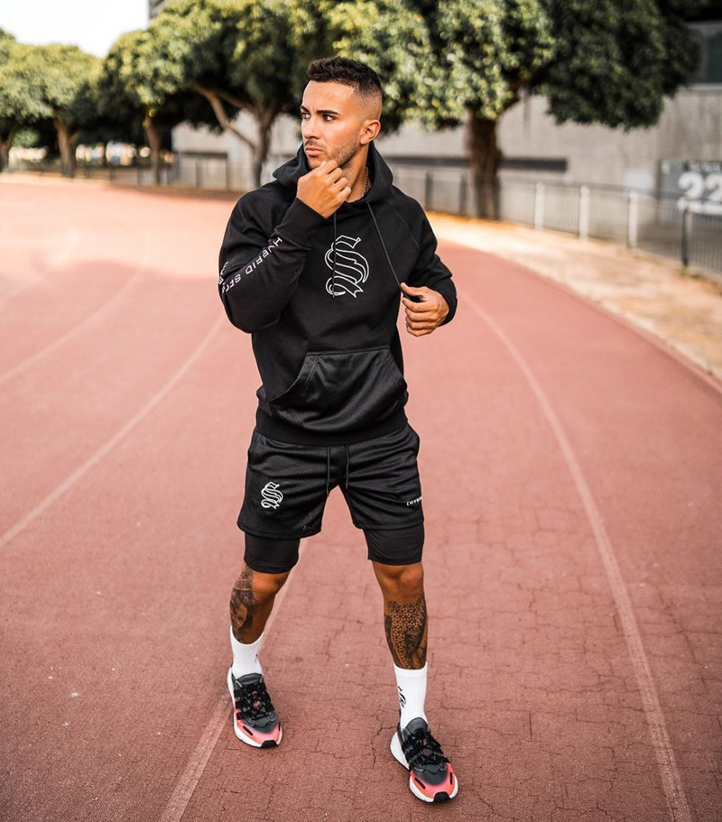 Pantaloncini sportivi alla moda a doppio strato per l'allenamento da uomo falso in due pezzi da basket in esecuzione fitness capris_voghion.com