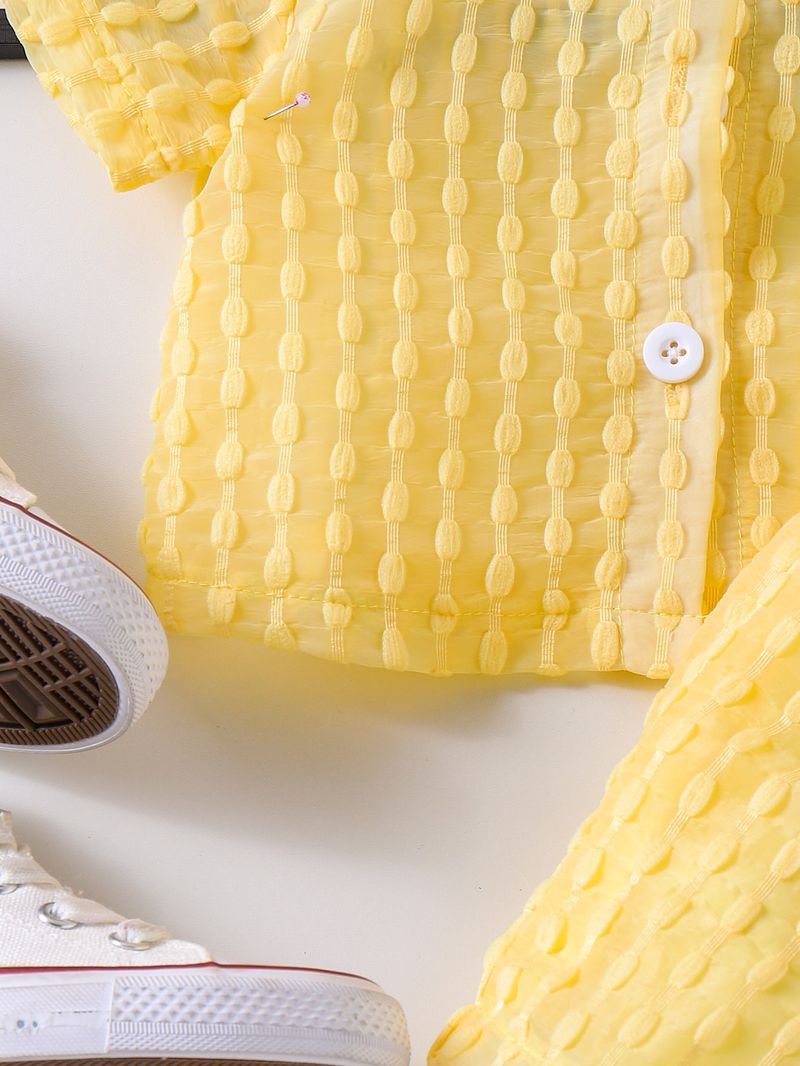 "Completo composto da maglietta gialla, gilet e pantaloncini per bambine dai 2 ai 7 anni - Completo in morbido cotone composto da 3 pezzi con eleganti stratificazioni"_voghion.com
