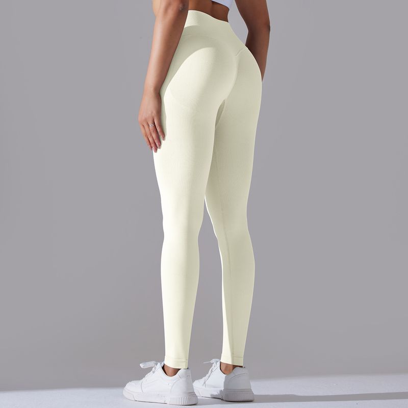 Pantaloni da yoga a nove punti da fitness da donna, lavorati a maglia, traspiranti, in tinta unita, a vita incrociata, color pesca, senza cuciture_voghion.com