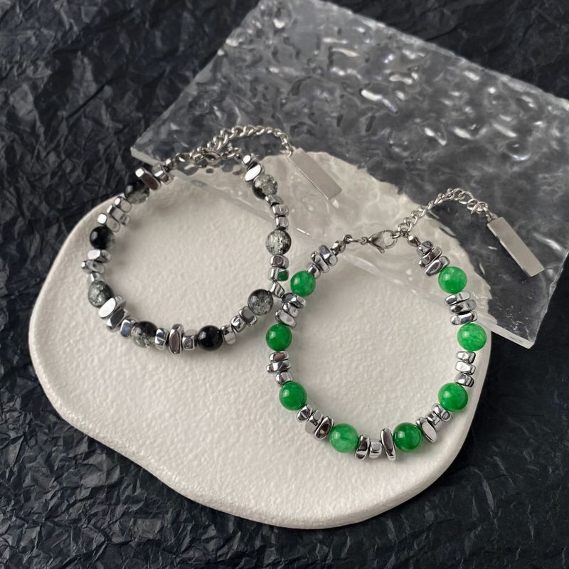 Den senaste omgången av designade kattögonstensarmband skarvade med INS trendiga handtillbehör titanstål obsidian herr- och damarmband_voghion.com