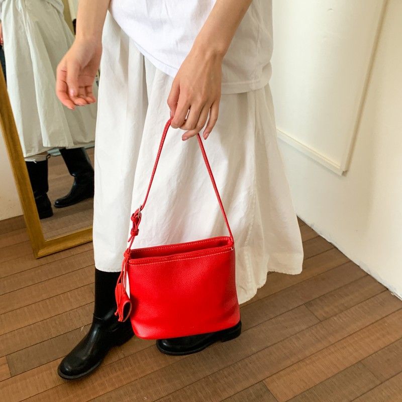 Borsa a secchiello semplice da portare a mano in stile coreano per le donne 2025, nuova nicchia versatile casual, trama litchi, spalla singola_voghion.com