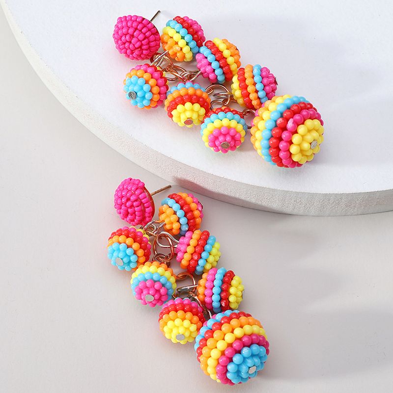 Orecchini con perline di riso fatti a mano in stile etnico con ciondolo a palla lunga bohémien per donna_voghion.com