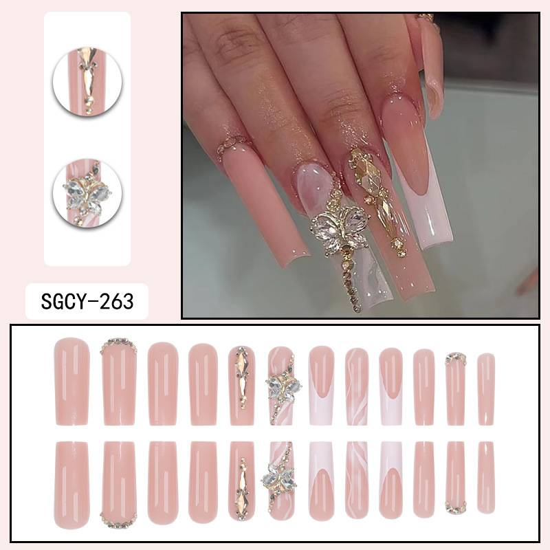 Elegante French Tip Press-On-Nägel mit champagnergoldener Schleife und Glitzer-Strasssteinen – Lange Kunstnägel für Damen, trendiges und glamouröses Maniküre-Set_voghion.com