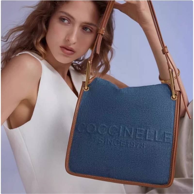 COCCINELLE's Vanessa Jeans Denim Tote Shoulder Bag, Blue Fabric With Brown Leather Trim, Stylish & Practical For Daily Use_voghion.com