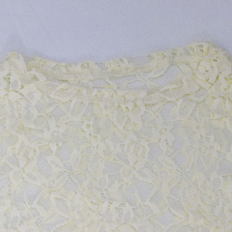 Elegante completo in pizzo da due pezzi: top trasparente aderente e pantaloni con elastico in vita per donna_voghion.com