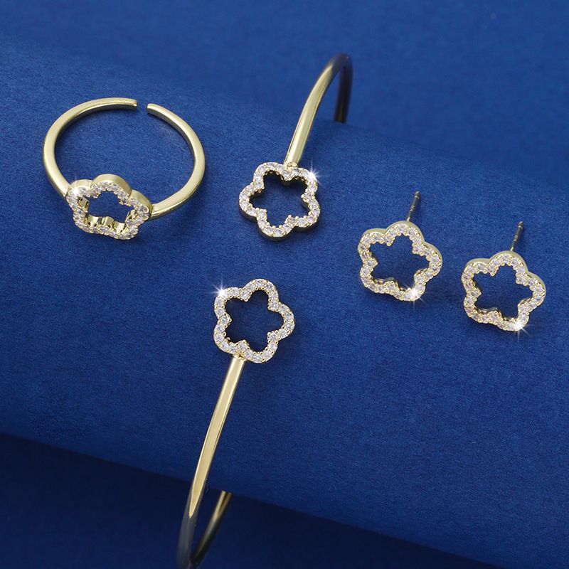 Women's Fashion Banquet Wedding Jewelry Set New Hollow Five petal Flower Diamond Bracelet Ring Earrings Three piece Set Five Leaf Flower Jewelry Set_voghion.com