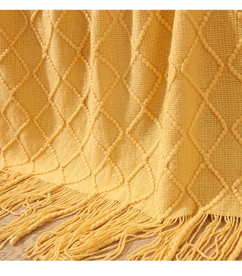 Divano nordico lavorato a maglia disegno geometrico nappa lana piccola coperta estiva in filo americano tessuto_voghion.com