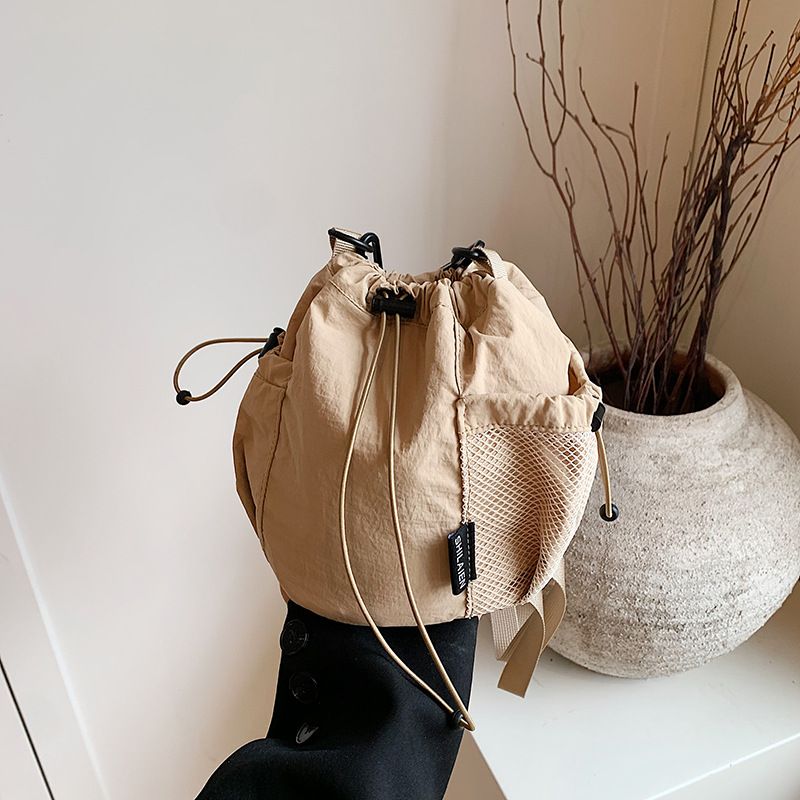 Borsa a secchiello piccola in tessuto casual e versatile da donna, stile coreano, nuova, a tracolla, con tracolla singola, di nicchia_voghion.com
