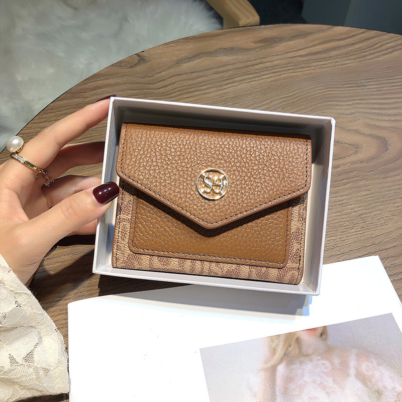 für Frauen 2025 Neue kurze echte Leder Compact Card Holder Münzclip Faltbare einfache Damen Brieftasche_voghion.com
