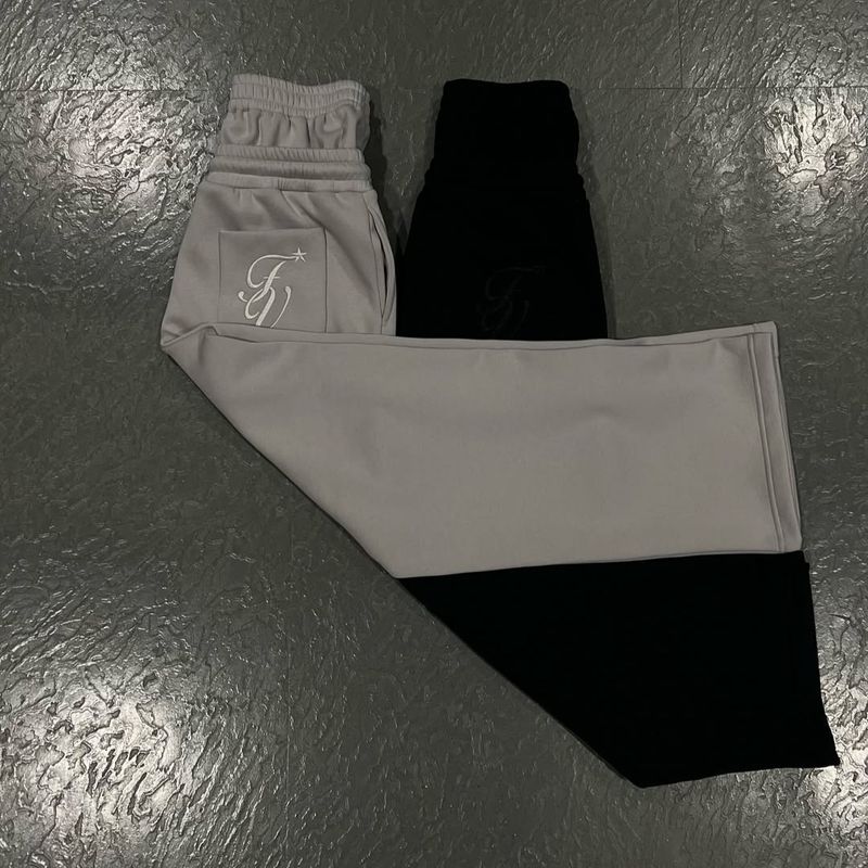 Calças de moletom de cintura alta da moda masculina e feminina - Calças de moletom largas com ajuste solto e cordão, estilo europeu e americano_voghion.com