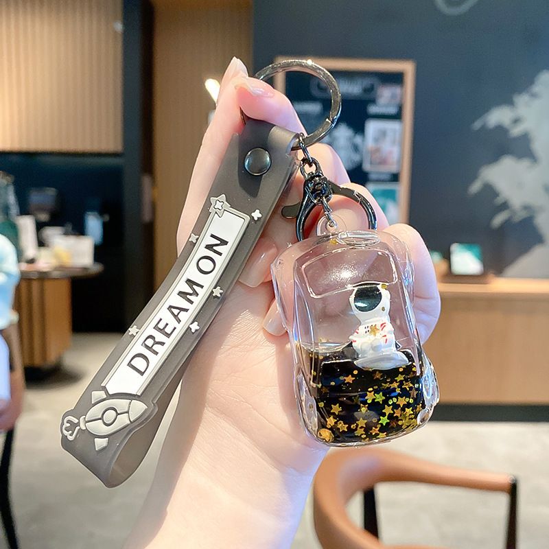 Portachiavi con ciondolo per auto astronauta con iniezione di olio di celebrità di Internet per donne, squisito portachiavi con decorazione per zaino a forma di astronauta dei cartoni animati_voghion.com