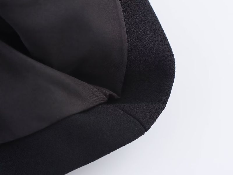 Traje de mujer de moda con chaleco asimétrico sencillo con cuello en V y pantalón ancho plisado._voghion.com