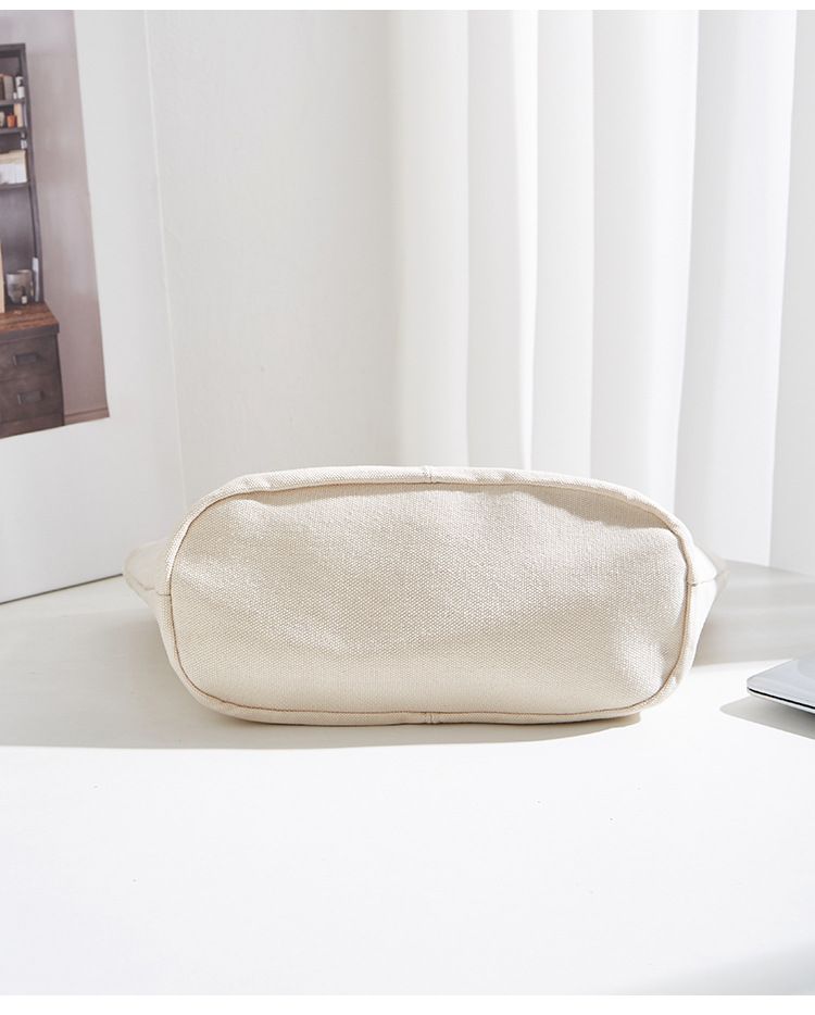 Borsa versatile e di grande capienza in versione coreana, la nuova borsa da donna minimalista in tela di quest'anno, manico in legno_voghion.com