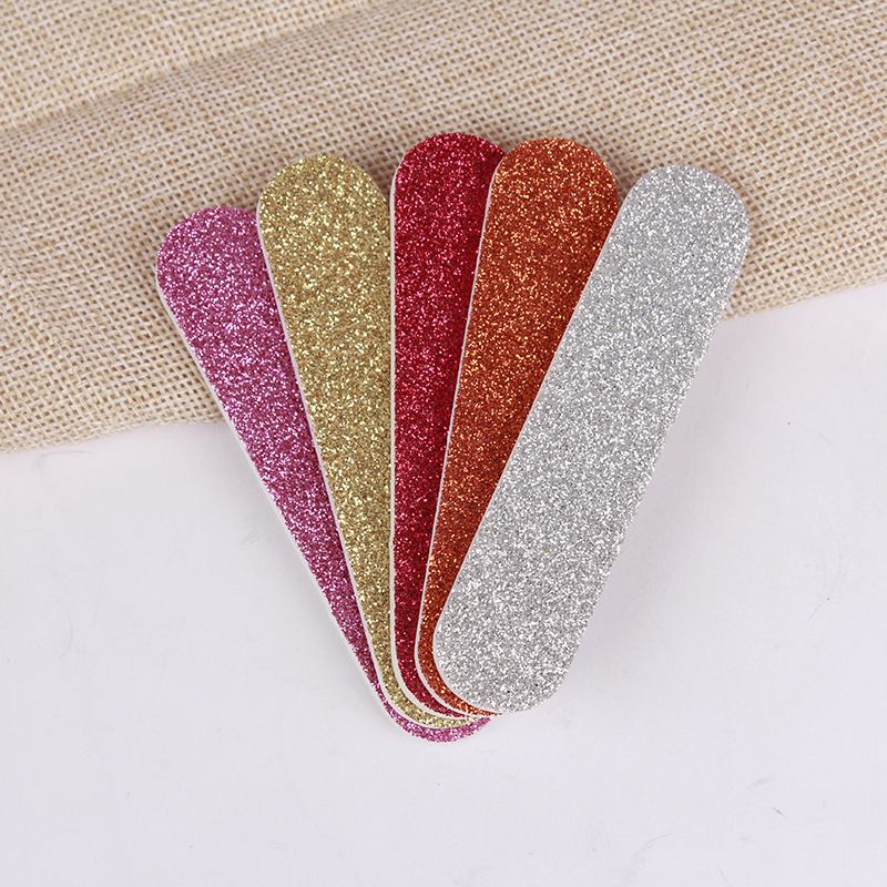 Mini con polvere glitterata, strumento artistico, striscia lucidante, spugna, lima per unghie stampata in EVA_voghion.com