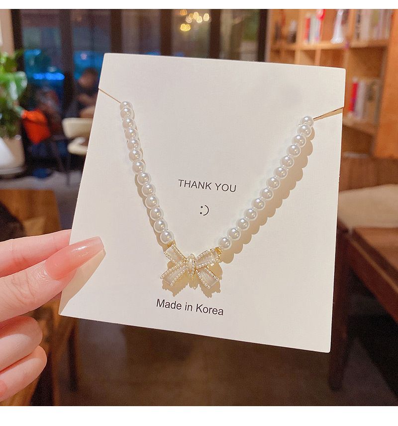Elegante parelketting voor vrouwen in stijl, licht luxe niche-ontwerp, veelzijdige strik sleutelbeenketting_voghion.com