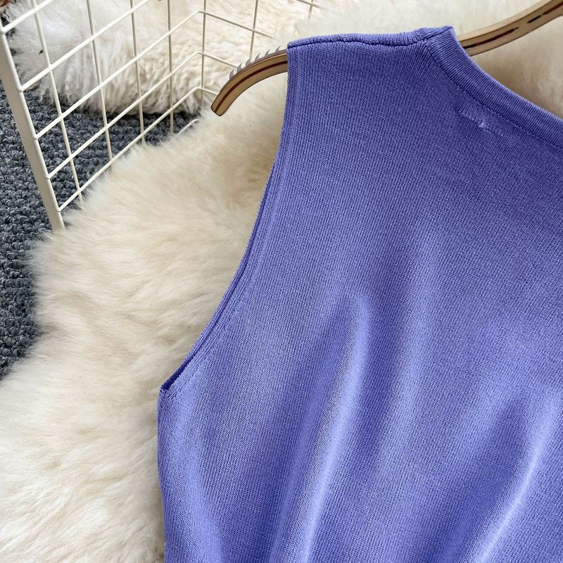 Abito da donna in maglia senza maniche con scollo rotondo, design aderente, con nappa, vita sottile e gonna di media lunghezza._voghion.com