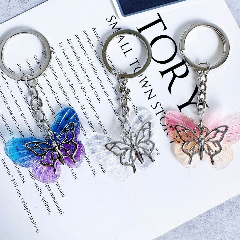 2025 Nuovo portachiavi a forma di farfalla in resina, squisita personalità, creativo, zaino, custodia per auricolari, ciondolo per auto, regalo semplice_voghion.com