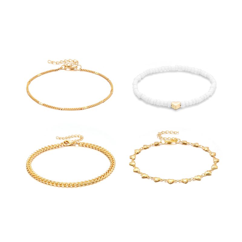 Set di cavigliere con perline a forma di cuore con catena in metallo multistrato New Beach, 4 pezzi_voghion.com