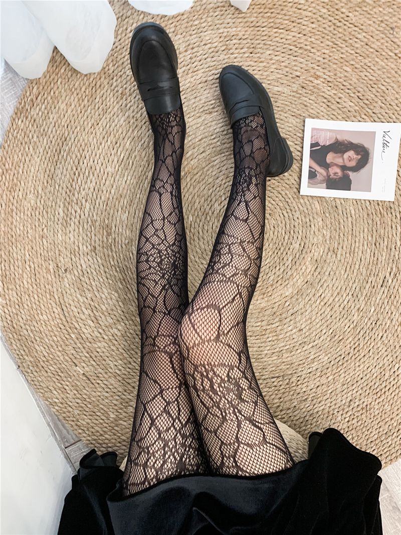 2024 Medias negras ahuecadas prensadas en caliente Jk Pantalones de malla sexy Letras grandes atractivas Calcetines de red de pesca con lazo_voghion.com