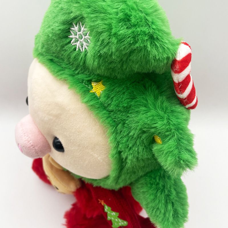 Adorabile peluche a forma di maialino natalizio con disegni di Babbo Natale e renne per una gioia natalizia_voghion.com