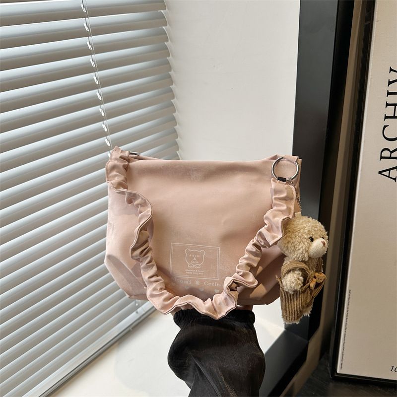 Nuova versione coreana del 2025, borsa a tracolla versatile con stampa di simpatici cartoni animati per studenti, borsa da pendolare di grande capacità_voghion.com