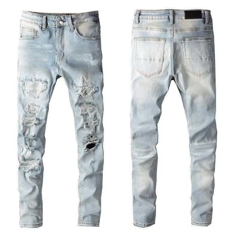 High Street Chiu brandneue, nachgewaschene Messerschnittlöcher in der Bettleraufkleber-elastischen Slim-Fit-Jeans des Mannes_voghion.com