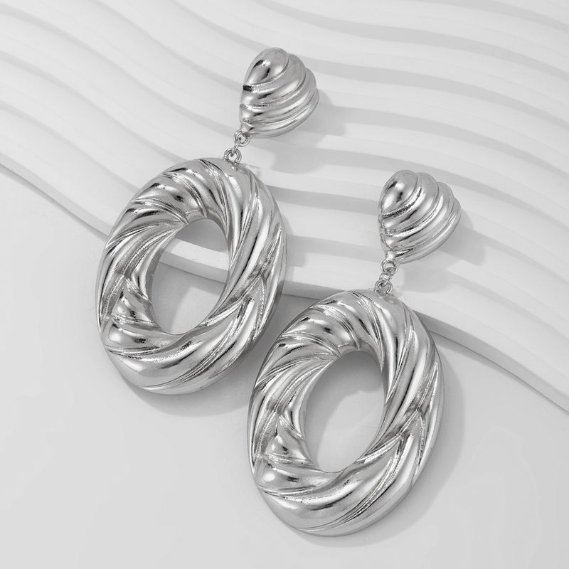 Personality metal geometric texture hollow earrings female irregular twisted glossy earrings earrings_voghion.com