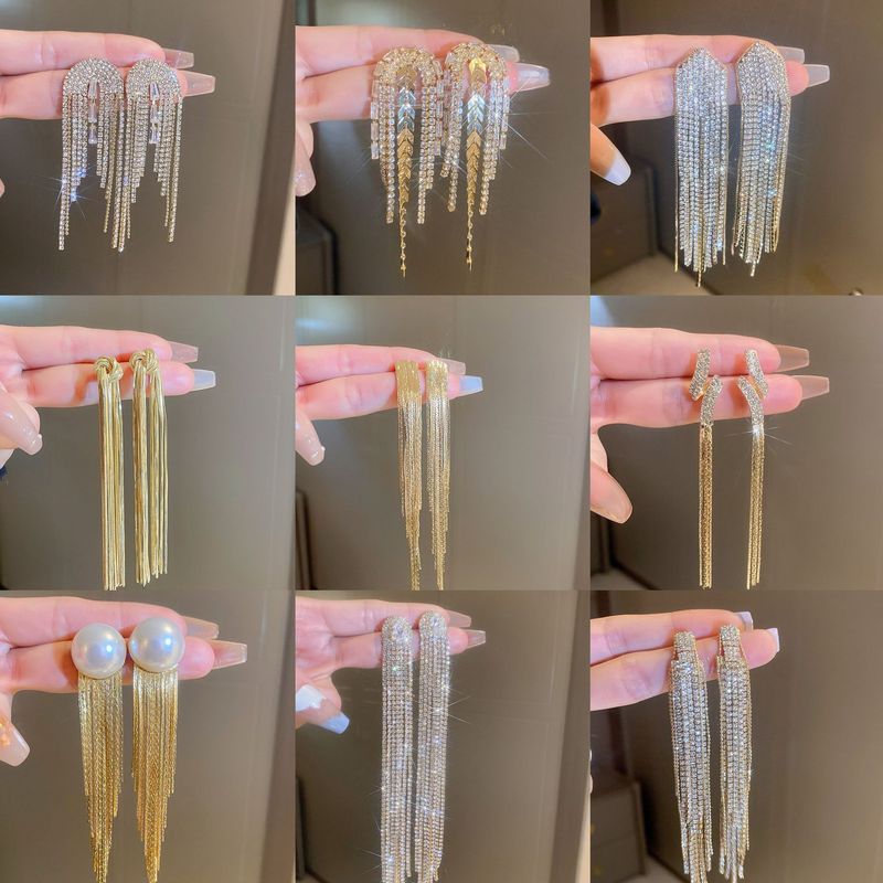 Orecchini pendenti con zirconi lunghi in metallo argentato, stile squisita, luce vento freddo, lusso e ciondolo a forma di foglia_voghion.com