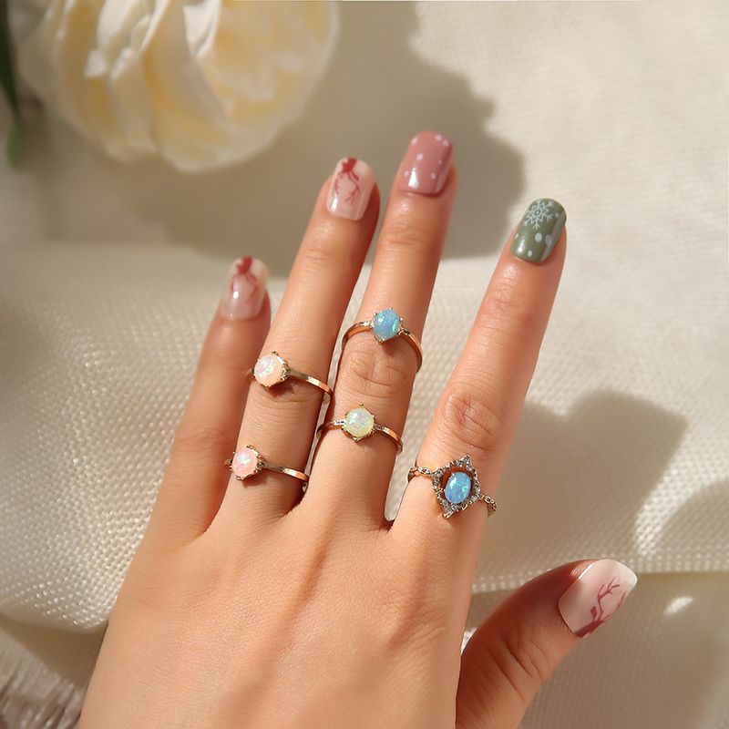 Neues modisches 5-teiliges Set mit Ringen aus Opalimitat in Bonbonfarben_voghion.com