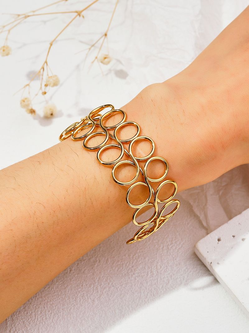 Bracelet en acier inoxydable creux simple en métal avec décoration à la main personnalisée en titane_voghion.com