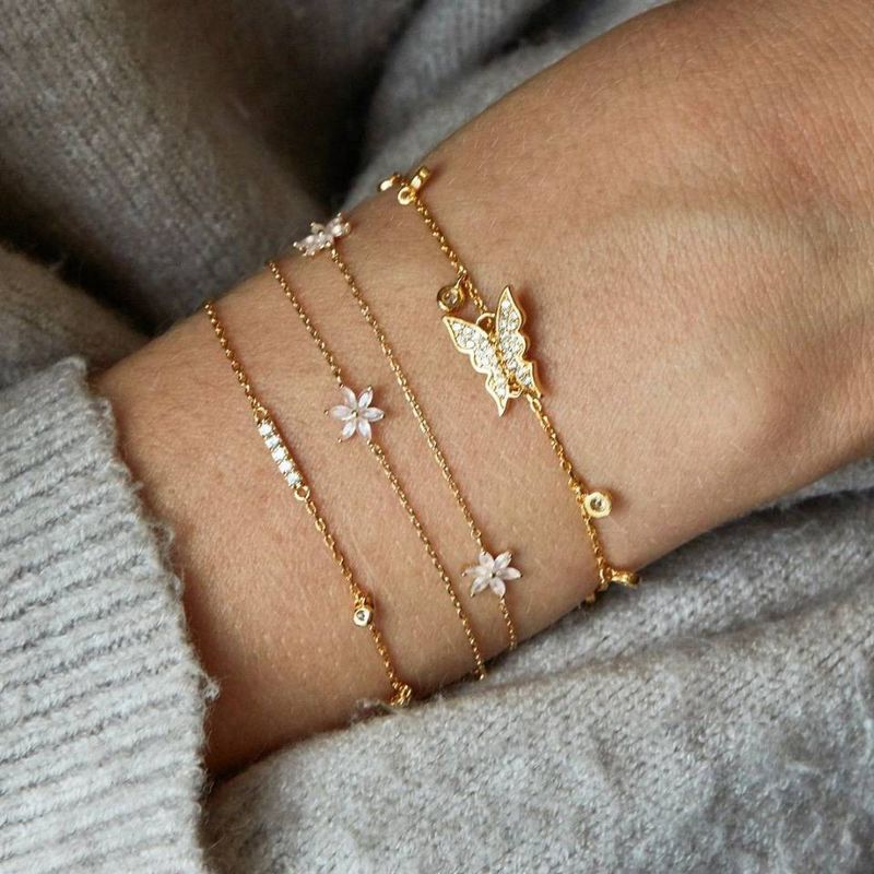 Minimalist and minimalist female personality butterfly studded diamond blooming flower with four piece set bracelet_voghion.com
