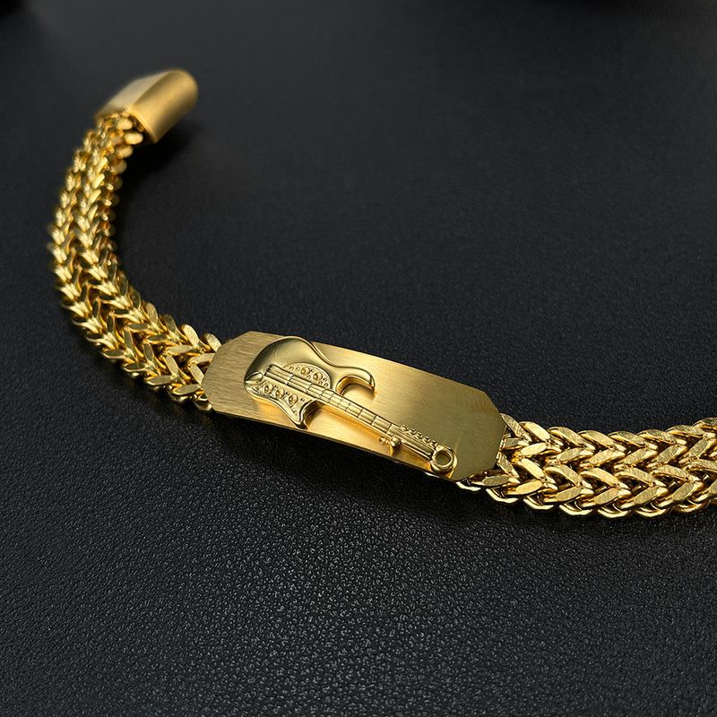 Divatos rozsdamentes acél dizájn, háromdimenziós gitár, aranyozott férfi karkötő_voghion.com