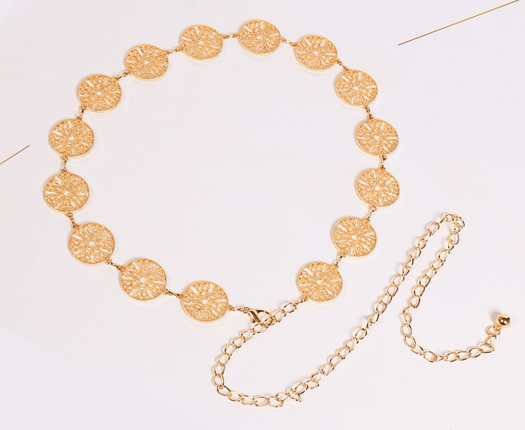 Cintura con catena in vita con decorazione circolare in metallo scavato, accessori moda donna_voghion.com