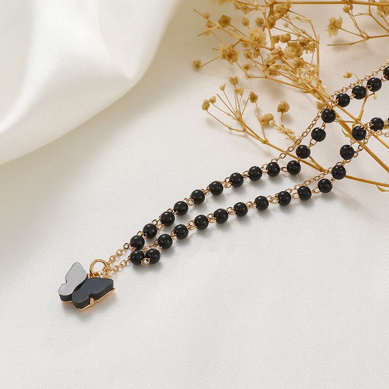 Collar con colgante de mariposa de doble capa, estilo gótico, diseño retro de nicho, cadena de clavícula con cuentas negras_voghion.com