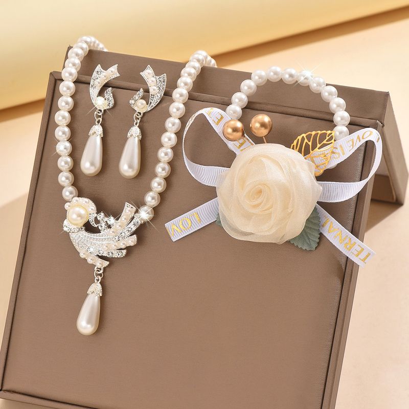 Set di gioielli da donna alla moda, collana di perle, orecchini, bracciale, set di fiori in lega, abito da sposa, personalità, temperamento alla moda femminile_voghion.com