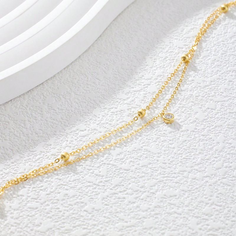 Un gioiello da caviglia per le donne, con ciondolo in zircone artificiale rotondo, minimalista, elegante, leggero e lussuoso, a doppio strato, in argento._voghion.com