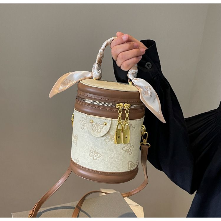 Borsa da donna retrò con motivo a farfalla, borsa a secchiello con colori a contrasto, borsa cilindrica da donna, borsa a tracolla con texture alla moda, design di nicchia_voghion.com