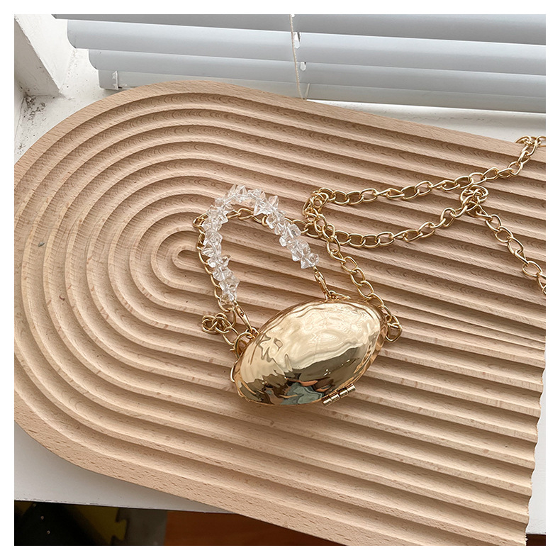 Mini 2024 Été Nouveau sac en coquille d'œuf en métal Sac de banquet de mode européenne et américaine Sac à bandoulière à bandoulière unique Sac pour femmes élégant_voghion.com