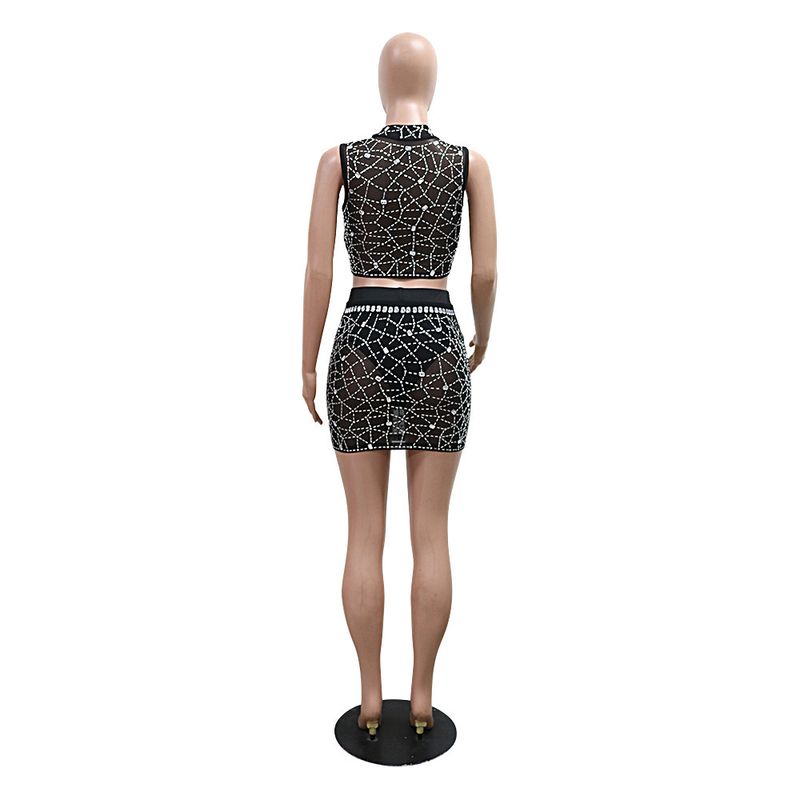 Completo due pezzi in rete con paillettes - Top corto con scollo tondo e minigonna aderente con lingerie_voghion.com