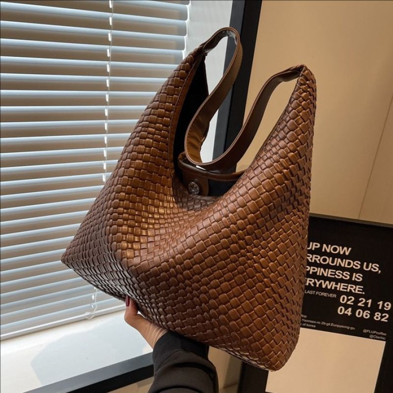 Nuova borsa da viaggio versatile da donna, di grande capacità, con tracolla in tinta unita e testurizzata, dal design alla moda._voghion.com