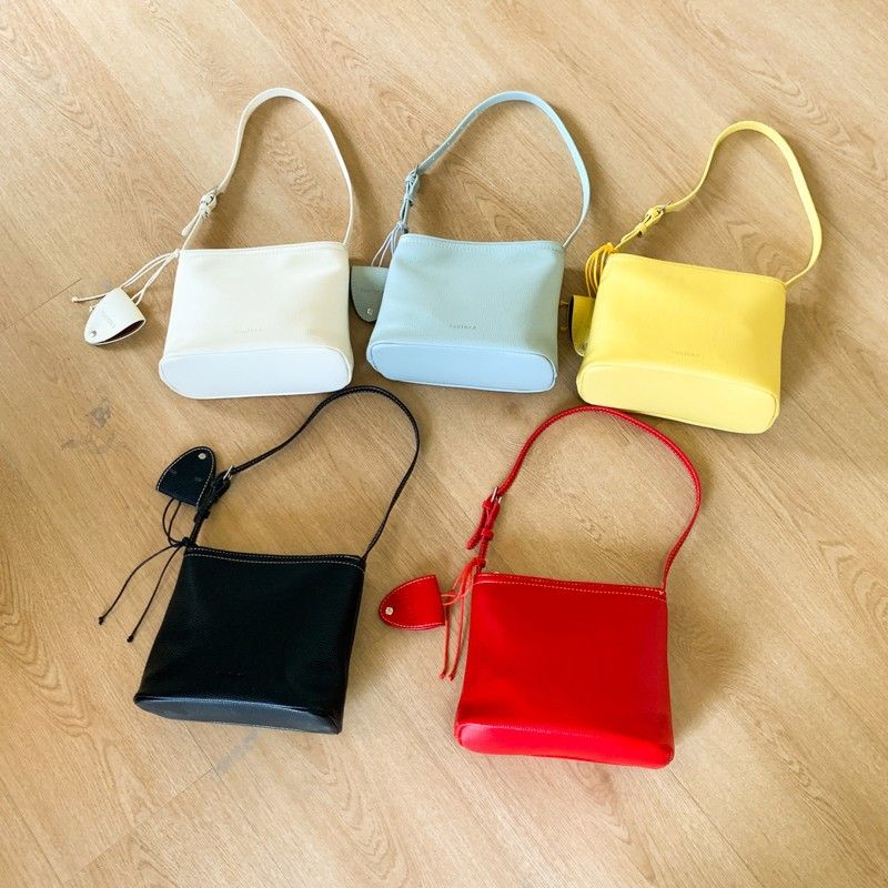 Borsa a secchiello semplice da portare a mano in stile coreano per le donne 2025, nuova nicchia versatile casual, trama litchi, spalla singola_voghion.com