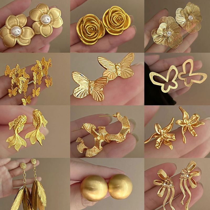 Orecchini a forma di farfalla con perla in argento placcato oro autentico con design esagerato, di alta qualità._voghion.com