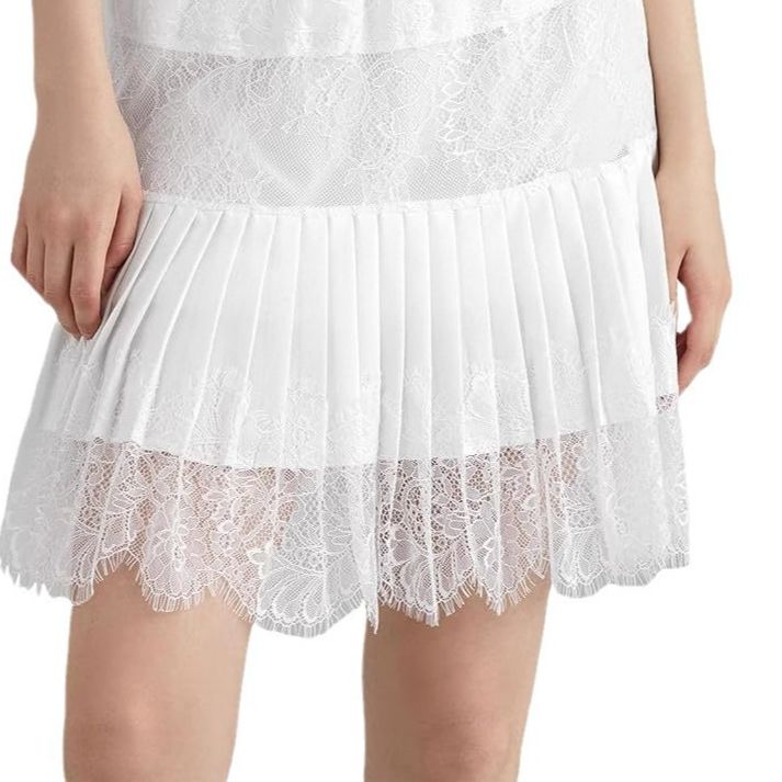 Minigonna in pizzo K per donna con gonna plissettata a strati a vita bassa e svolazzante_voghion.com