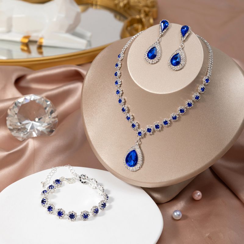 Collana orecchini bracciale borsa da sera con pietre preziose alla moda, set di quattro pezzi per feste e locali notturni_voghion.com