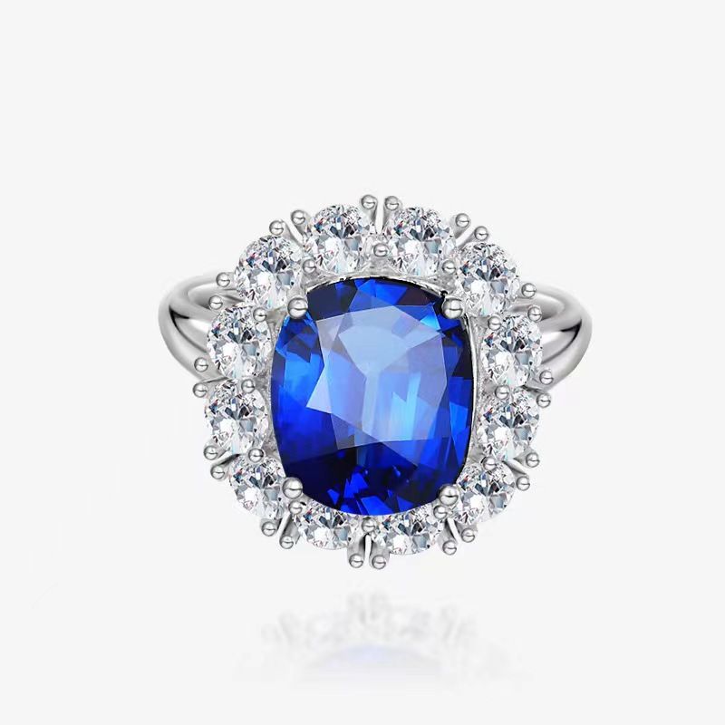 Eleganter blauer Smaragd-Persönlichkeits-roter Frauen-Silber-Intarsien-voller 10*12 simulierter Diamantring_voghion.com