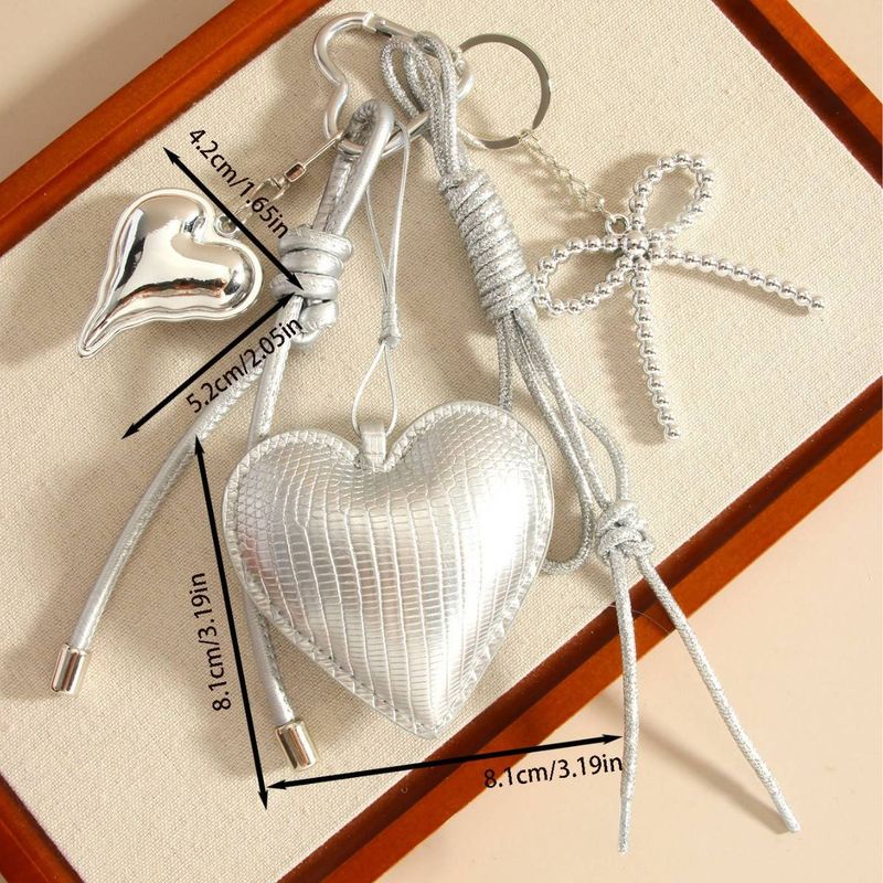 Portachiavi con fiocco a forma di cuore in PU argento di lusso - Accessorio alla moda per borse e portafogli, regalo perfetto per donne e ragazze_voghion.com