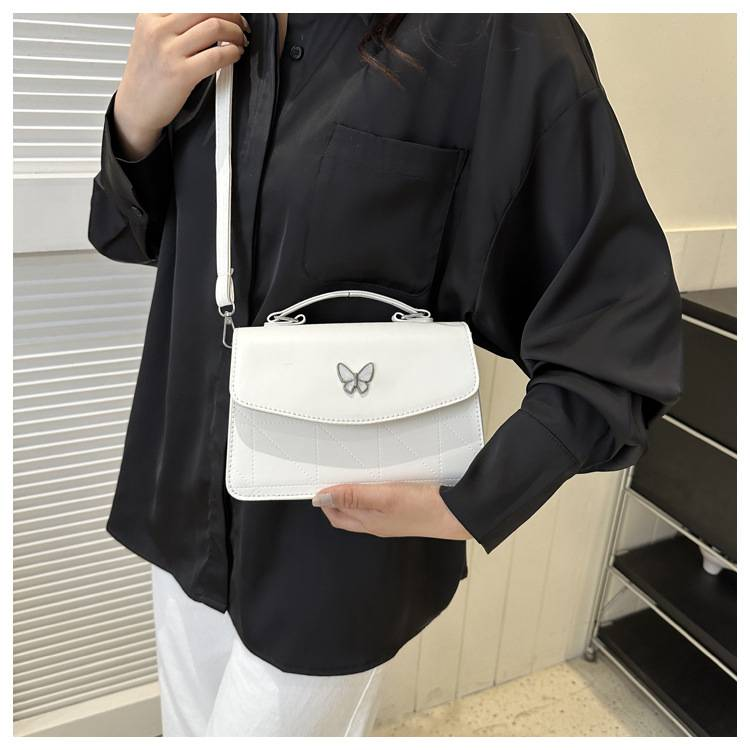 Fransk lyxig handväska i mild stil Butterfly Dekorativ liten väska Dam 2024 Sommar Ny västerländsk stil Crossbody-väska med en axel_voghion.com